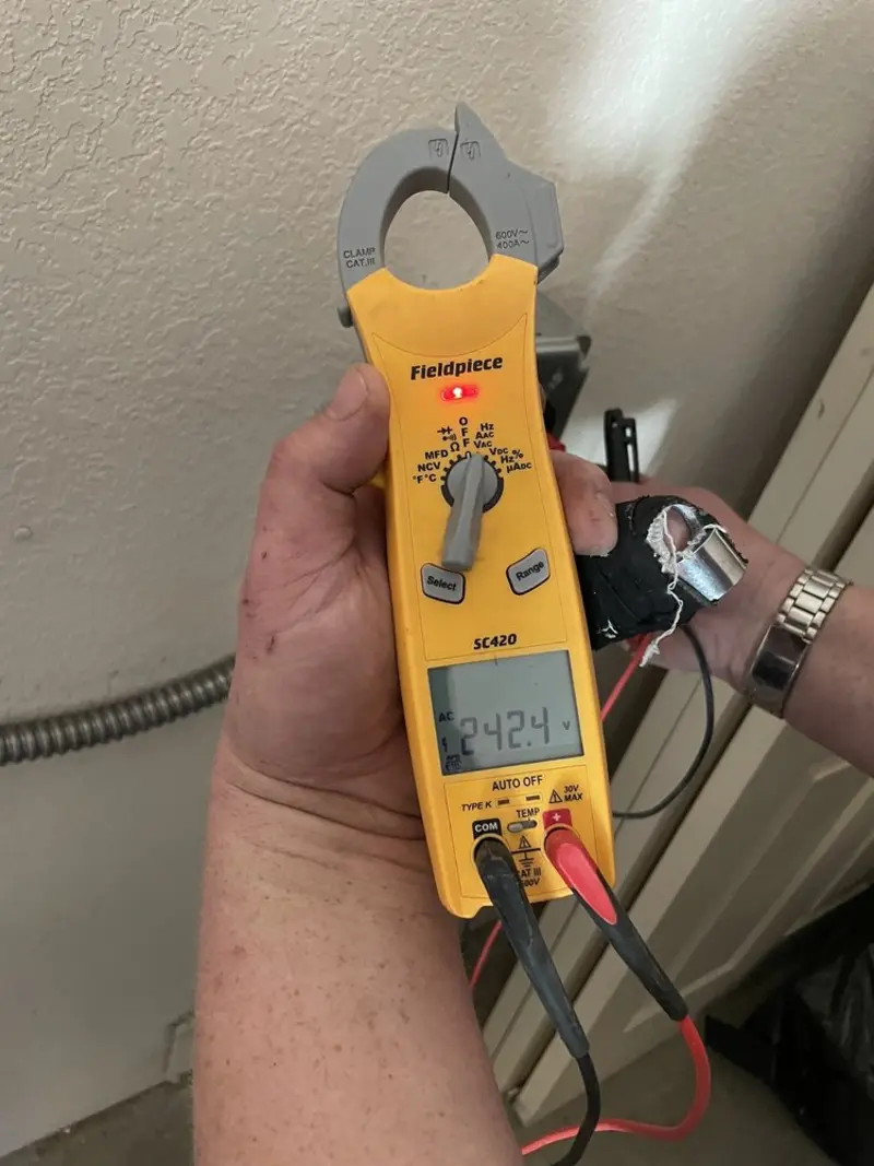 Voltage testing with clamp meter during Generator Installation in Dallas